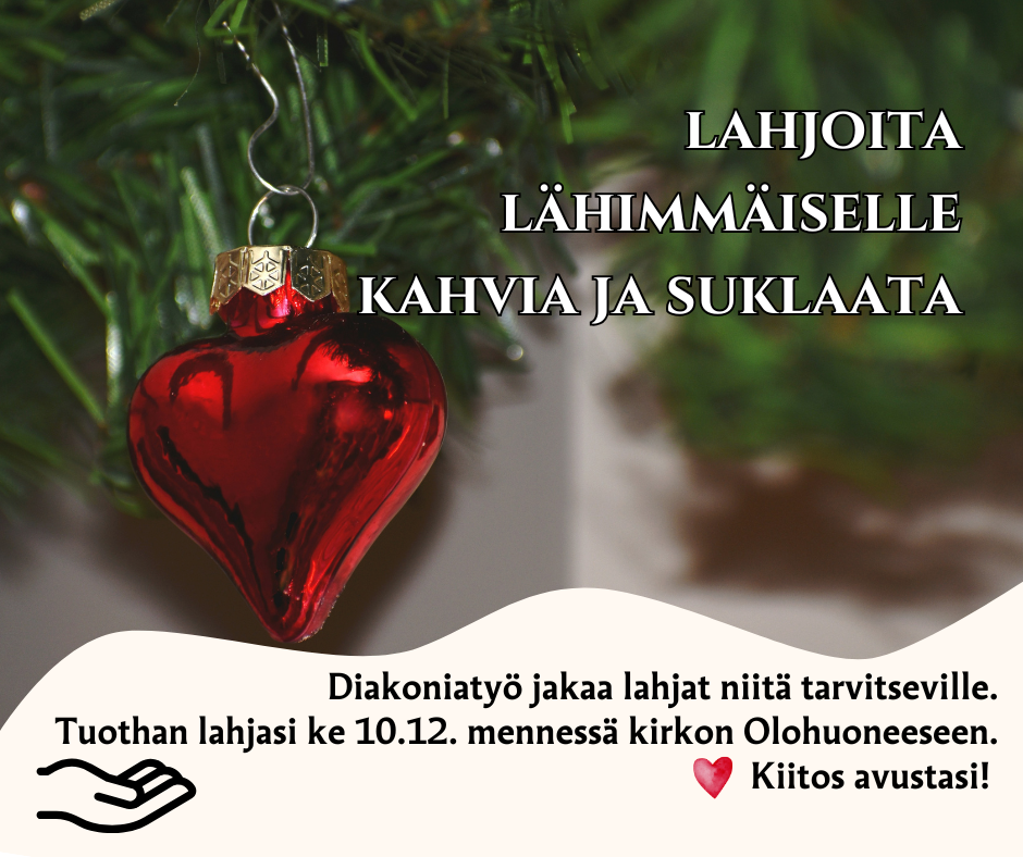 Joulukuusenkoristeena punainen sydän, taustalla tekokuusen vihreä oksa.
